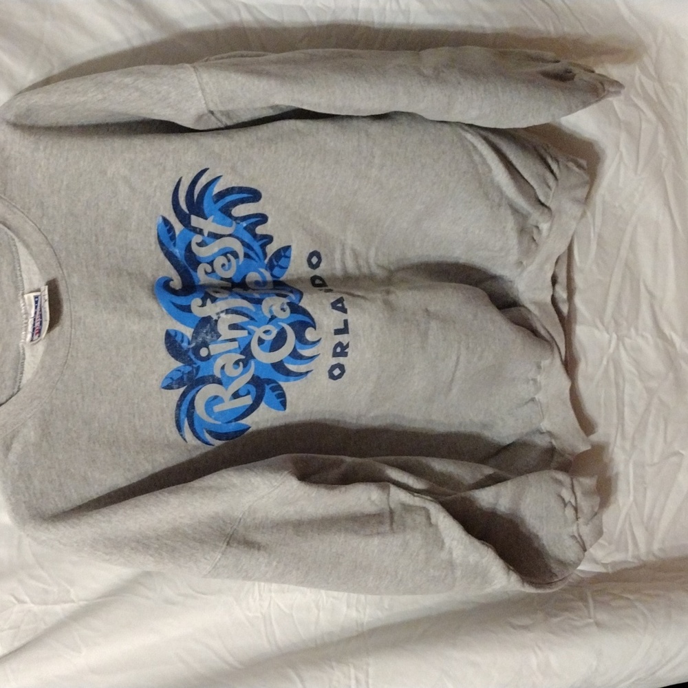2 For$ 8 Sale Classic And Charming heavy sweatshirt with rainforest Cafe logo.